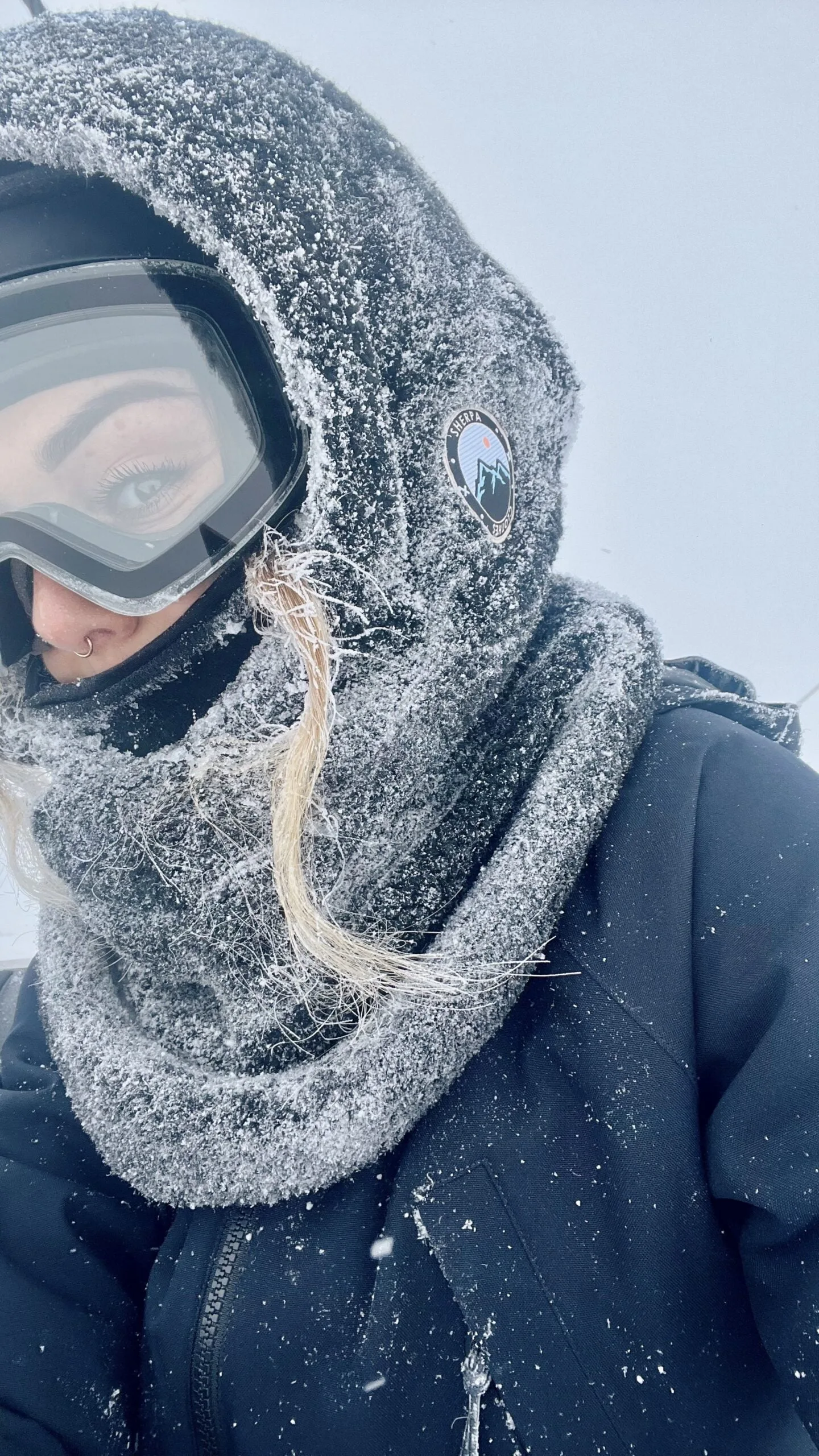 Sherpa Clothes A woman wearing a scarf and goggles